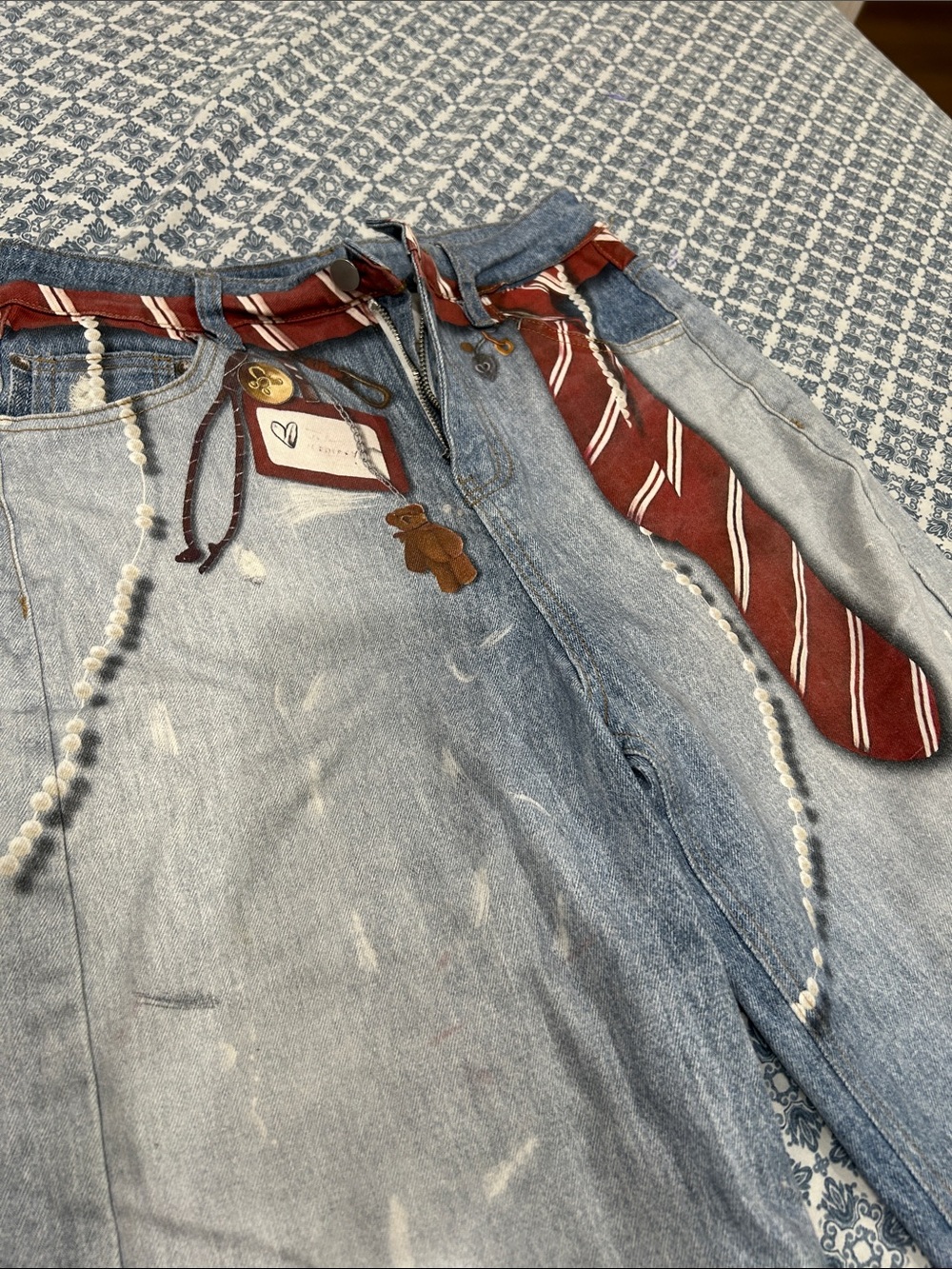Relaxed Wide-Leg Distressed Blue Jeans with Red Tie Accent - Picture 2 of 3